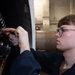 USS Ronald Reagan (CVN 76) Sailors install jet components