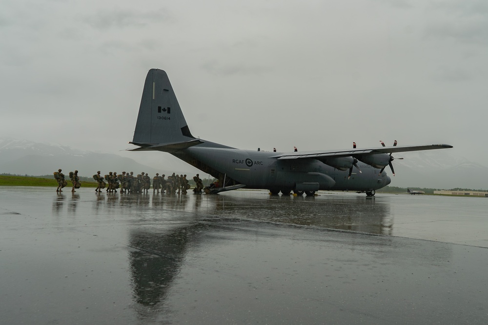 Paratroopers gear up for a RED FLAG-Alaska 24-2 static-line jump