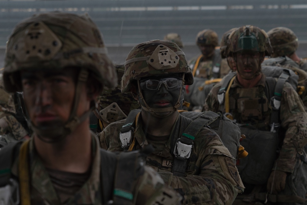 Paratroopers gear up for a RED FLAG-Alaska 24-2 static-line jump