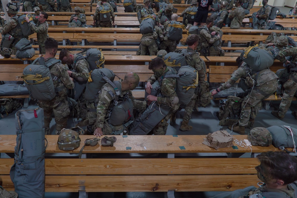 Paratroopers gear up for a RED FLAG-Alaska 24-2 static-line jump