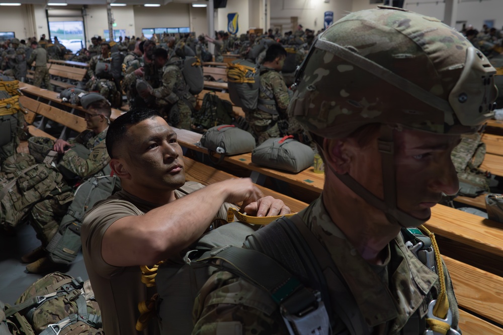 Paratroopers gear up for a RED FLAG-Alaska 24-2 static-line jump