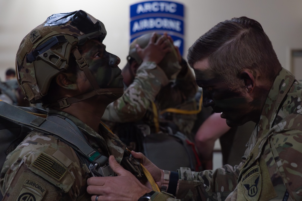 Paratroopers gear up for a RED FLAG-Alaska 24-2 static-line jump