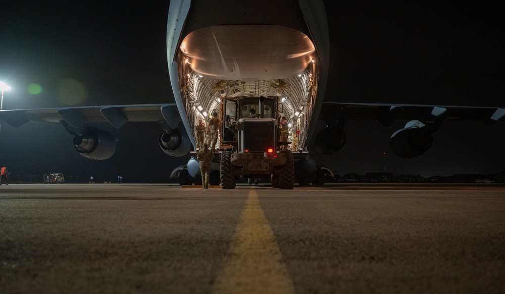 U.S. military equipment is carefully loaded onto a U.S. Air Force C-17 Globemaster III aircraft at Air Base 101 in Niamey, Niger