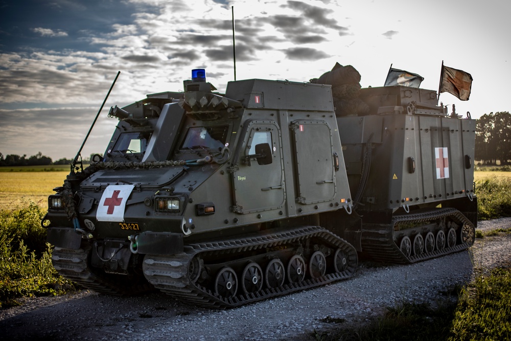 4th Reconnaissance Battalion Marines receive Regiment of Gotland patches from Swedish medics during BALTOPS 24