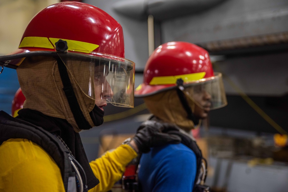 USS Ronald Reagan (CVN 7Sailors conduct  general quarters drill