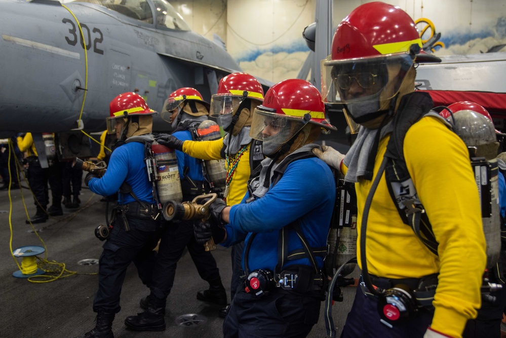 USS Ronald Reagan (CVN 7Sailors conduct  general quarters drill