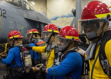 USS Ronald Reagan (CVN 7Sailors conduct  general quarters drill