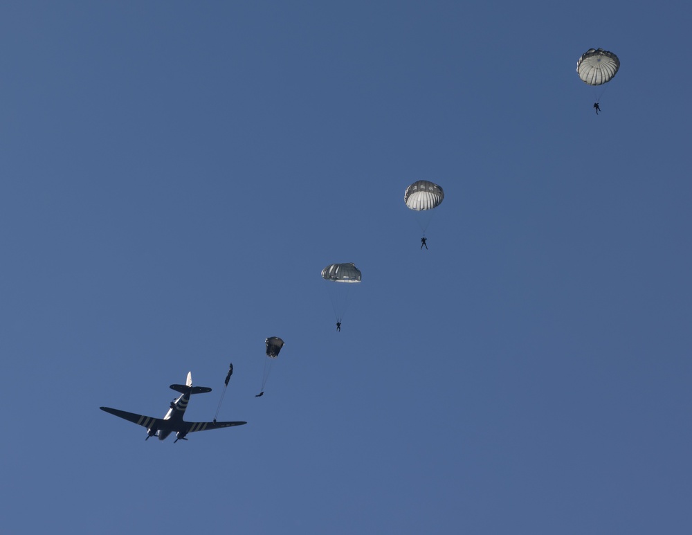 Multi-national paratroopers commemorate D-Day with historic jump into Normandy, France.