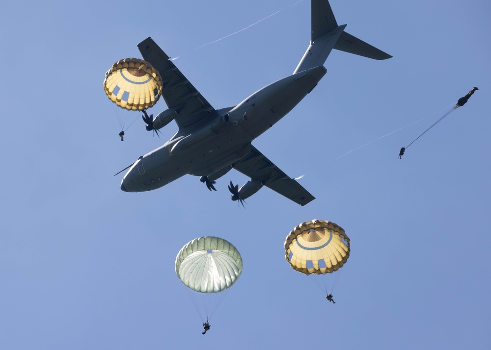 Multi-national paratroopers commemorate D-Day with historic jump into Normandy, France.