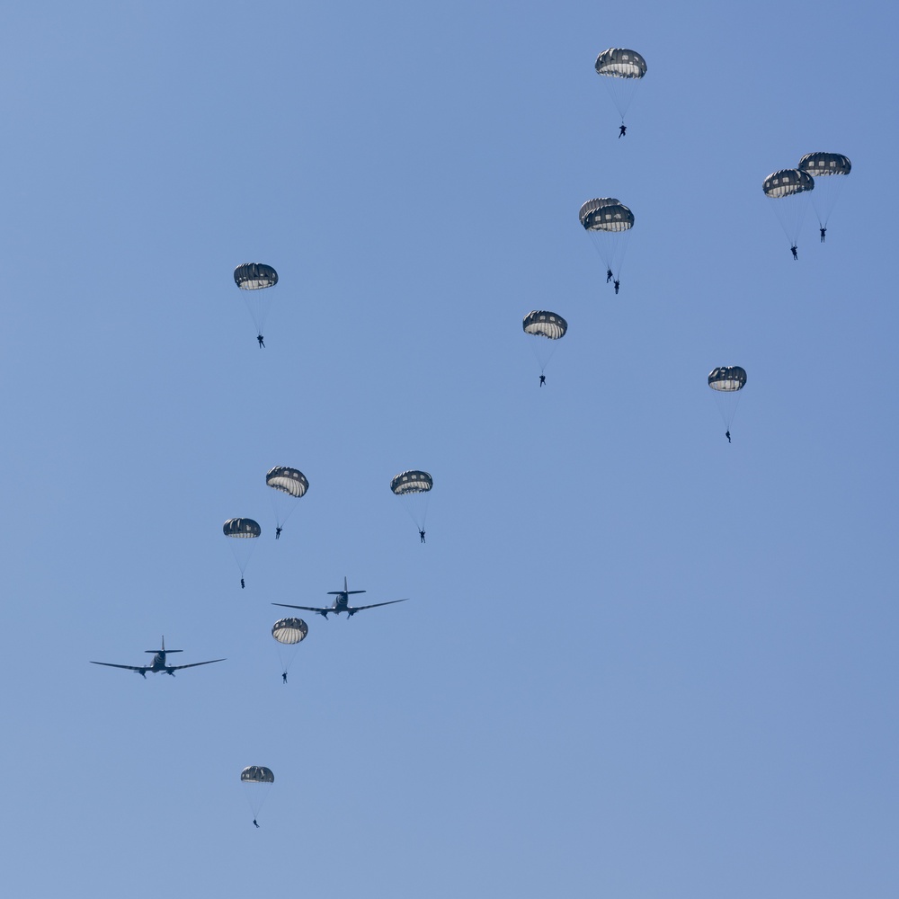 Multi-national paratroopers commemorate D-Day with historic jump into Normandy, France.