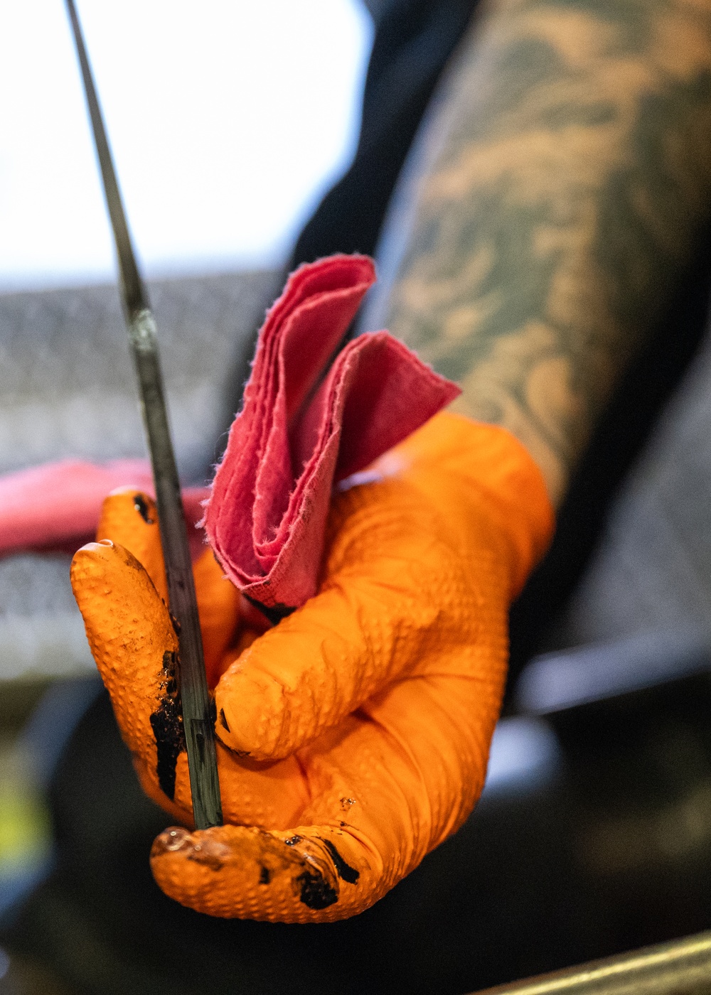 Dipstick is pulled from a Detroit Diesel Engine