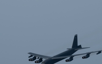 B-52H Stratofortress flies in formation with a MC-130J Commando II over the CENTCOM area of responsibility