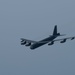 B-52H Stratofortress flies in formation with a MC-130J Commando II over the CENTCOM area of responsibility