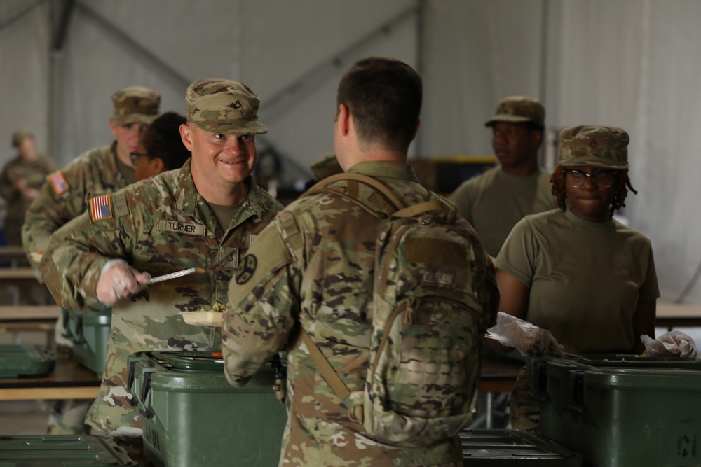 Cooking under fire: 142 Quartermaster Platoon and HHT feed Soldiers during XCTC