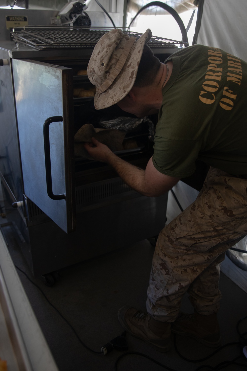 U.S. Marine food service specialists prepare evening chow at Integrated Training Exercise 4-24