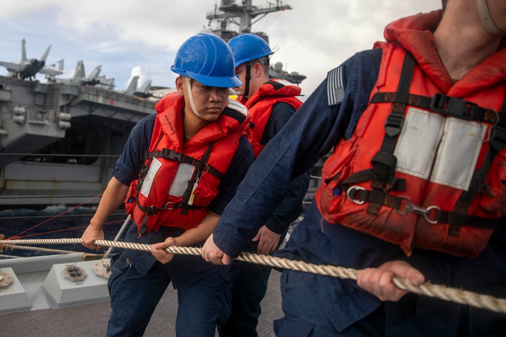 USS Ralph Johnson Conducts Replenishment-at-Sea with USS Theodore Roosevelt