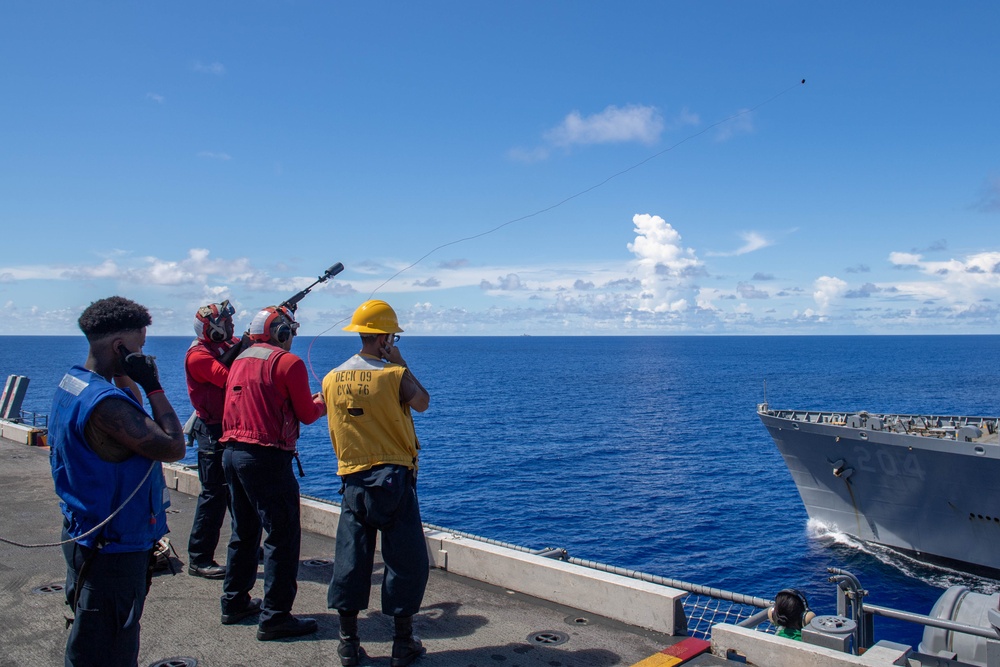 USS Ronald Reagan (CVN 76) conducts a fueling-at-sea and replenishment-at-sea with USNS Rappahannock (T-AO 204) and  USNS Charles Drew (T-AKE-10)