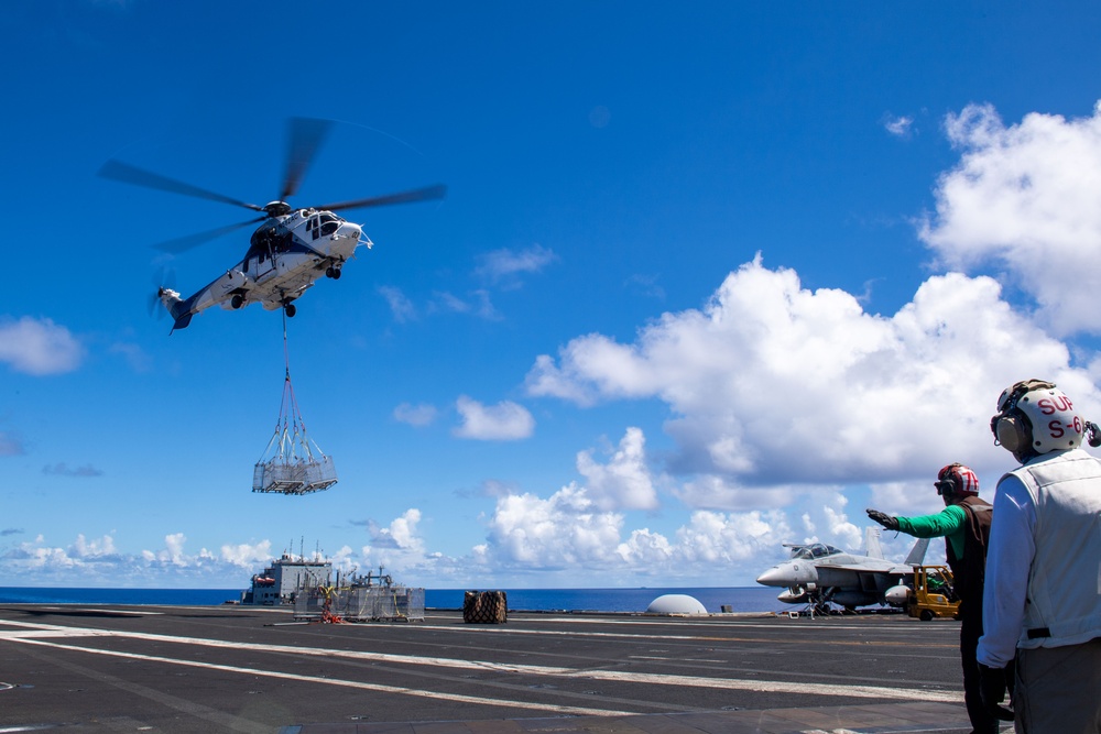 USS Ronald Reagan (CVN 76) conducts a fueling-at-sea and replenishment-at-sea with USNS Rappahannock (T-AO 204) and  USNS Charles Drew (T-AKE-10)