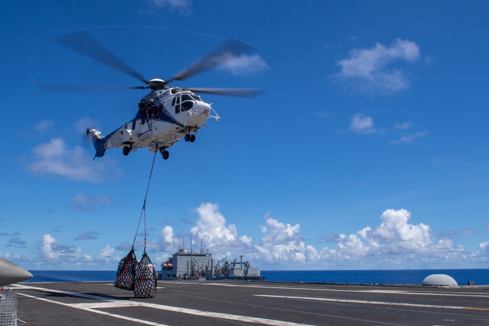 USS Ronald Reagan (CVN 76) conducts a fueling-at-sea and replenishment-at-sea with USNS Rappahannock (T-AO 204) and  USNS Charles Drew (T-AKE-10)