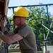 Solder removing old soffit from building