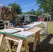 Soldier cuts new soffit for restoration of building