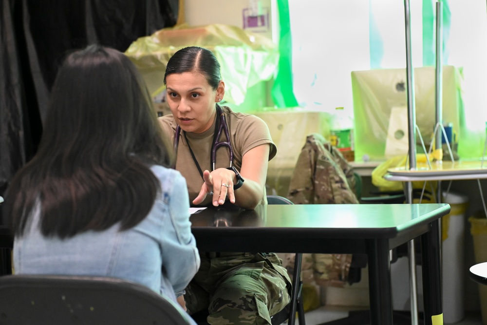 Army Reserve Physician's Assistant interviews patient