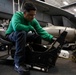 USS Carl Vinson (CVN 70) Sailor Cleans an F/A-18F Super Hornet seat.