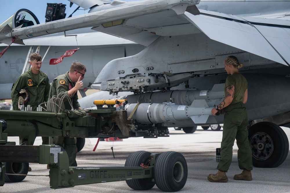 Marine All-Weather Fighter Attack Squadron (VMFA(AW)) 224 loads ordnance onto F/A-18 Hornet aircraft