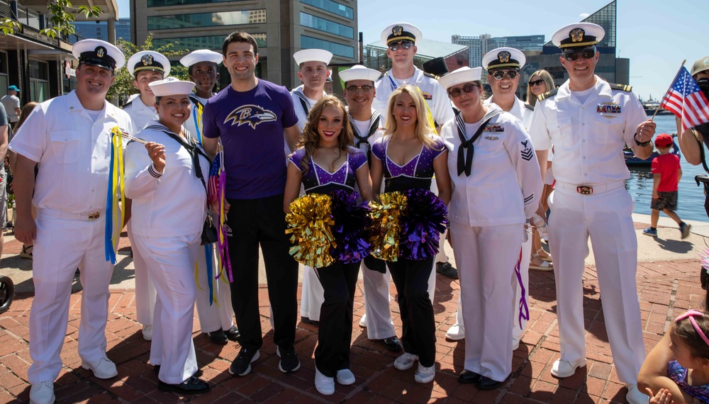 Kids on the Bay parade with the Baltimore Ravens cheerleaders.