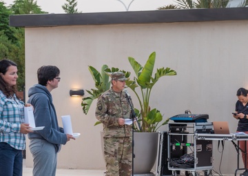 Soldiers honor the fallen during a Memorial Day candlelight service