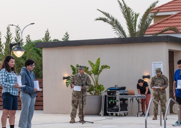 Soldiers honor the fallen during a Memorial Day candlelight service