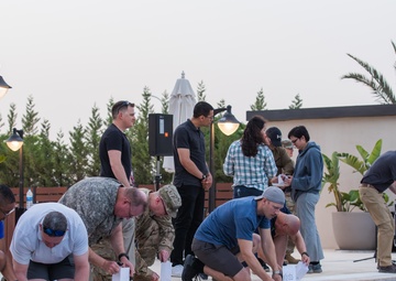 Soldiers honor the fallen during a Memorial Day candlelight service