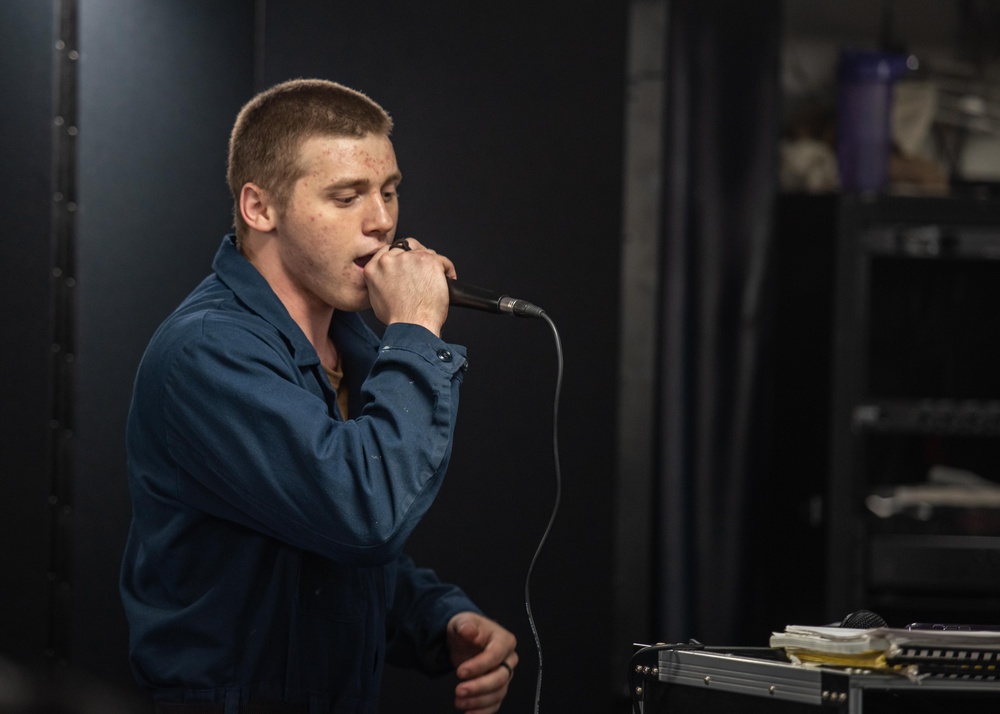 USS Ronald Reagan (CVN 76) Sailors participate in karaoke night hosted by Morale,  Welfare, and Recreation