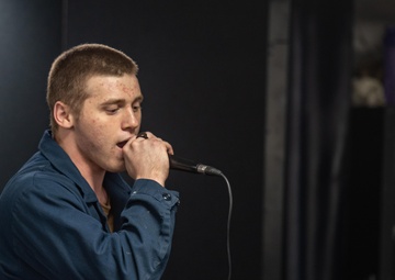 USS Ronald Reagan (CVN 76) Sailors participate in karaoke night hosted by Morale,  Welfare, and Recreation