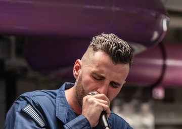 USS Ronald Reagan (CVN 76) Sailors participate in karaoke night hosted by Morale,  Welfare, and Recreation