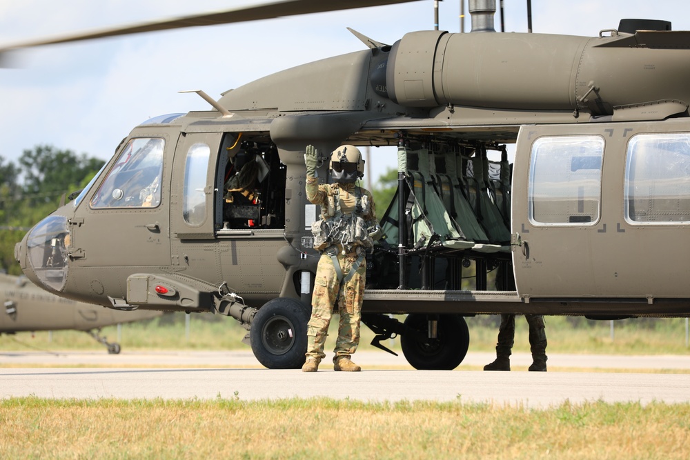 Soldiers waived onboard UH-60 Blackhawk helicopter