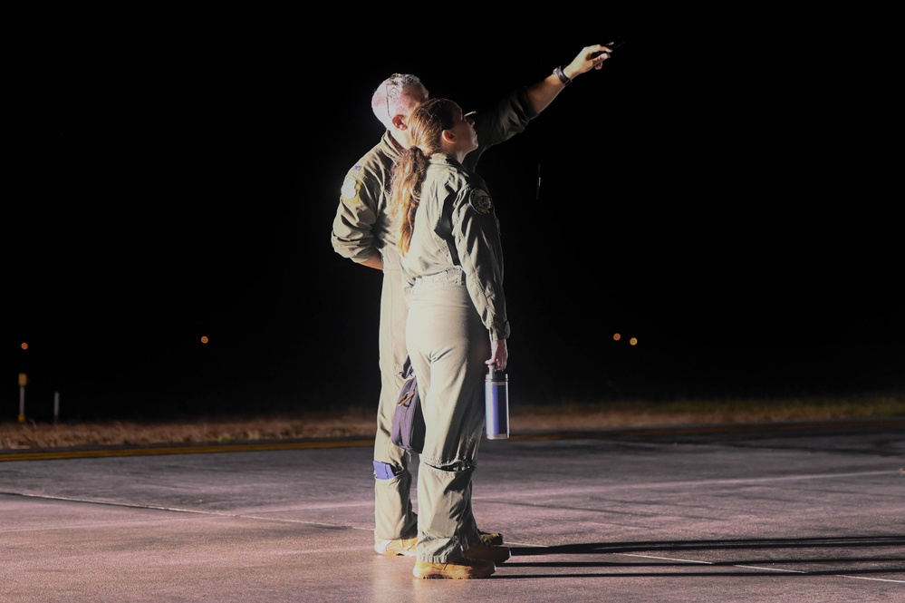 Col. Thomas Bowman, 36th Operations Group commander, explains features of a 37th Expeditionary Bomb Squadron B-1B Lancer to Chief Master Sgt. Merissa Schmidt, 36th Operations Group senior enlisted leader