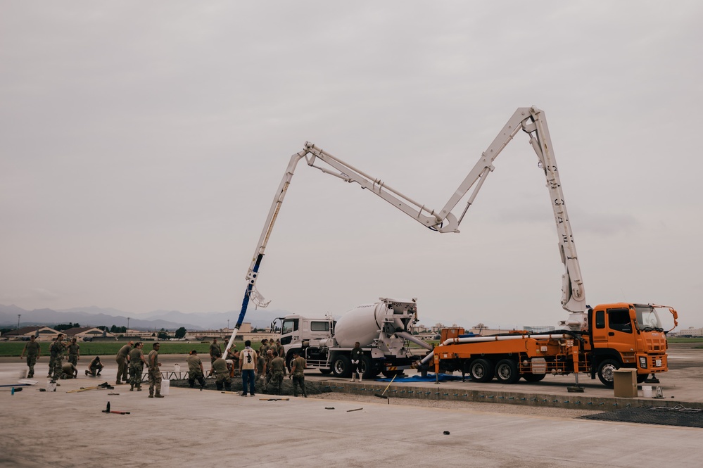 The 139th Civil Engineer Squadron lay concrete for ramp extention