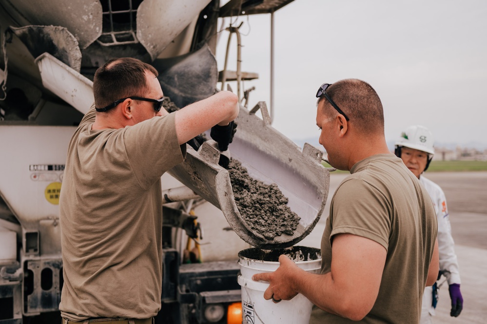 The 139th Civil Engineer Squadron lay concrete for ramp extention