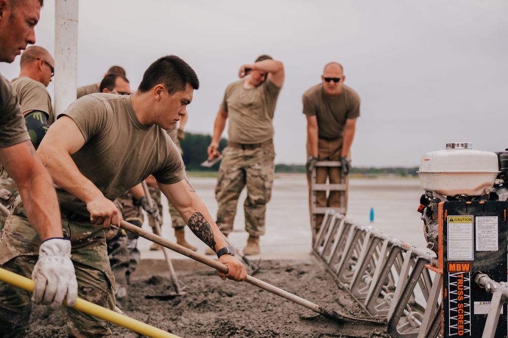 The 139th Civil Engineer Squadron lay concrete for ramp extention