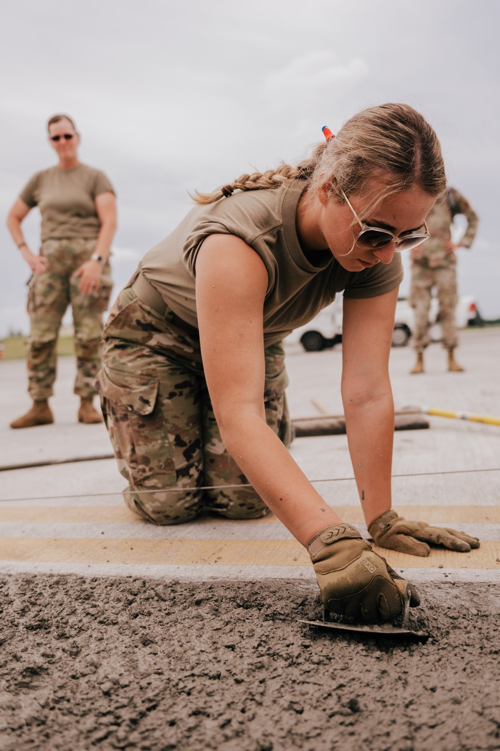 The 139th Civil Engineer Squadron lay concrete for ramp extention