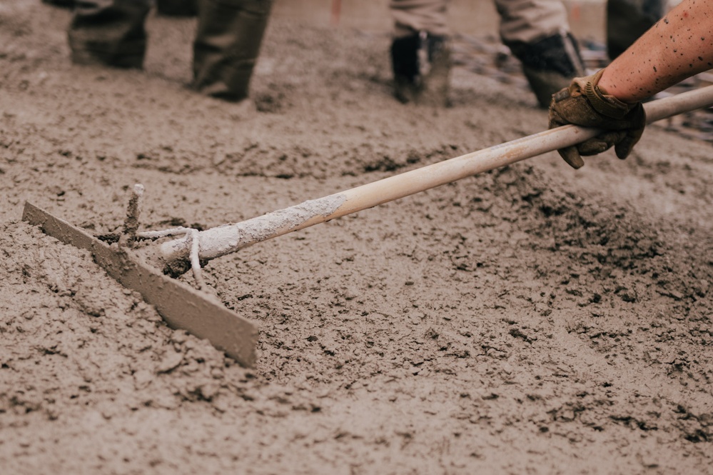 The 139th Civil Engineer Squadron lay concrete for ramp extention