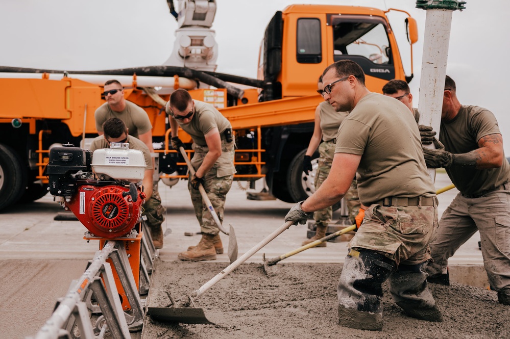 The 139th Civil Engineer Squadron lay concrete for ramp extention