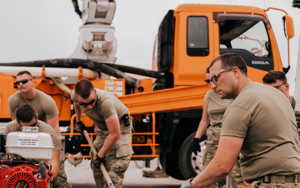 The 139th Civil Engineer Squadron lay concrete for ramp extention
