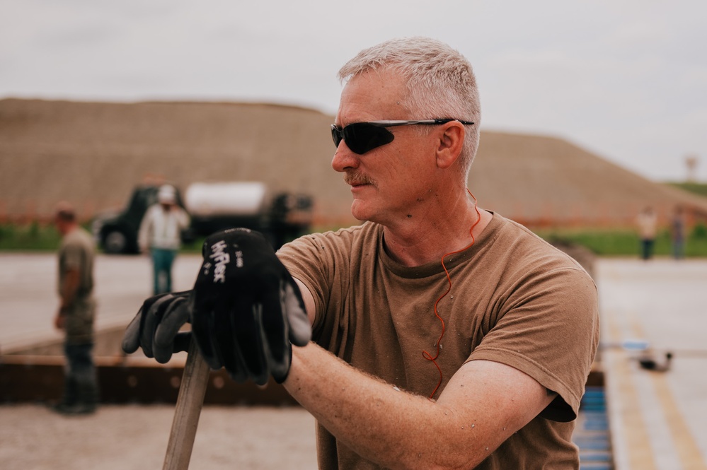 The 139th Civil Engineer Squadron lay concrete for ramp extention