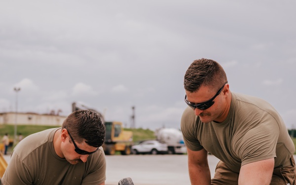The 139th Civil Engineer Squadron lay concrete for ramp extention