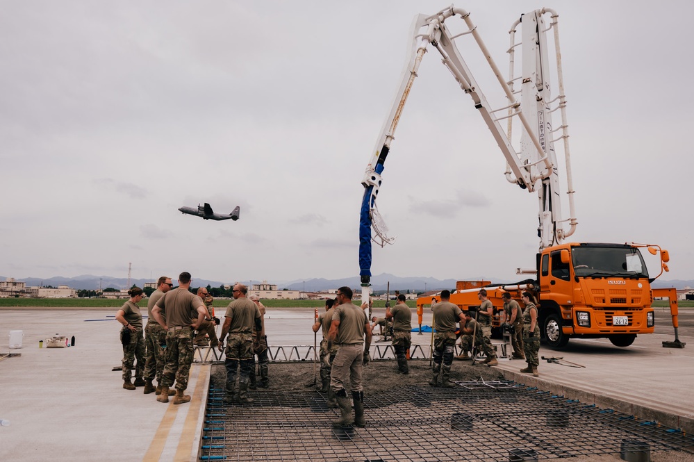 The 139th Civil Engineer Squadron lay concrete for ramp extention