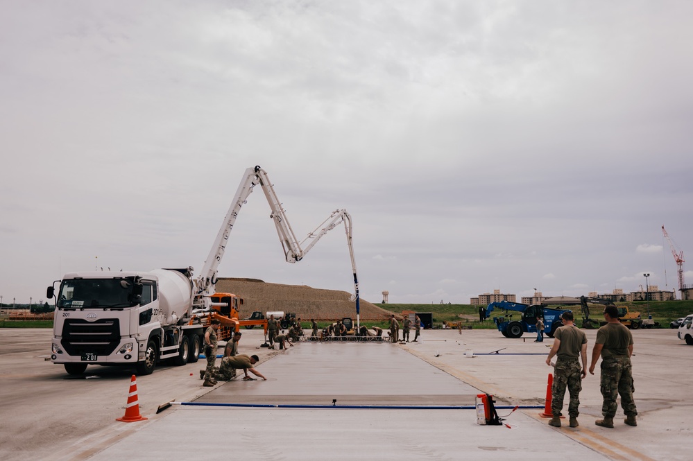 The 139th Civil Engineer Squadron lay concrete for ramp extention