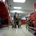 An EOD Technician Approaches a Simulated IED During an Airport Drill