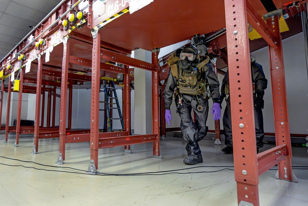 An EOD Response Team Approaches a Simulated Explosive Device in the Airport Baggage Handling Area